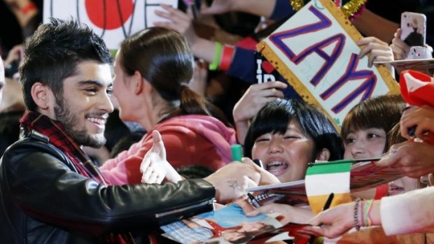 Zayn Malik signing autographs in Japan. 