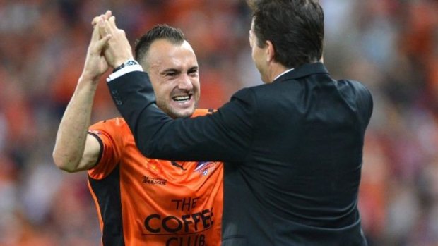 Mike Mulvey celebrates with Ivan Franjic during the semi-final against Melbourne Victory on Sunday.