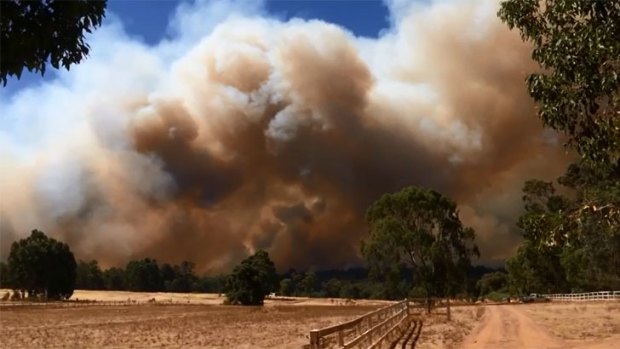 Huge smoke plumes billowed in the Shire of Mundaring on Sunday.
