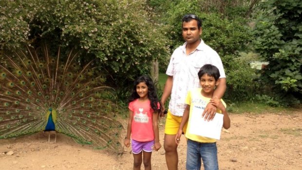 "They were about to fall in, and he tried to save them." Svaanik Kumar with his children Hansel, 7, and Bhumisha, 6.