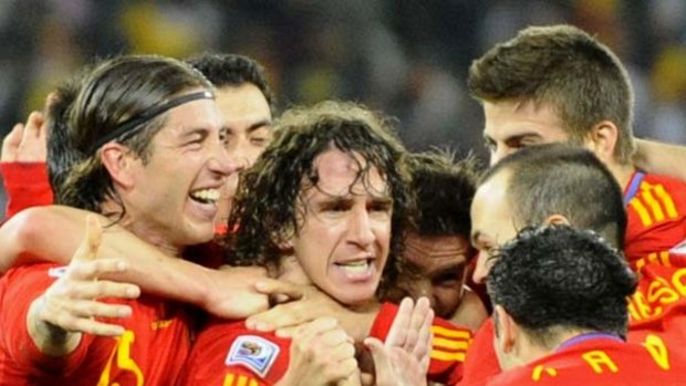 Ending with a flourish ... Spain's Carles Puyol, centre, celebrates with his teammates after heading home the winner against Germany in their World Cup semi-final in Durban.