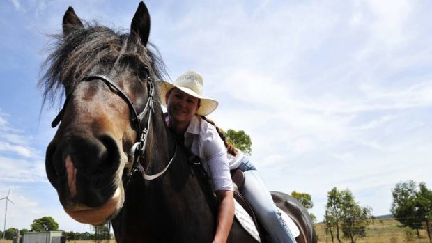 Owner of a stud horse farm near Bungendore, Lisa Wilson and her rare Shire Horse, Jock.