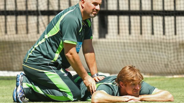 Australian cricket team Physiotherapist Alex Kountouris works on all-rounder Shane Watson.