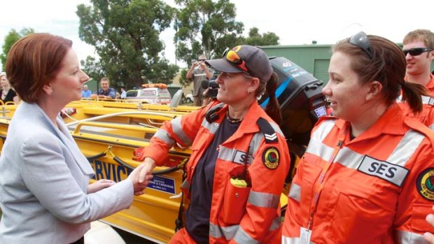 Well done &#8230; PM Julia Gillard with SES volunteers.