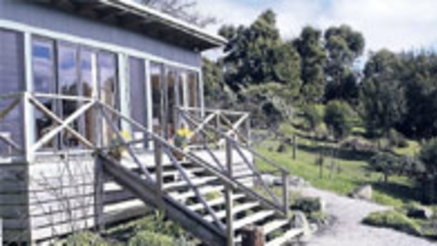 Zesty nest ... Lime Tree Cottage has views across Apollo Bay; the comfortable bedroom.