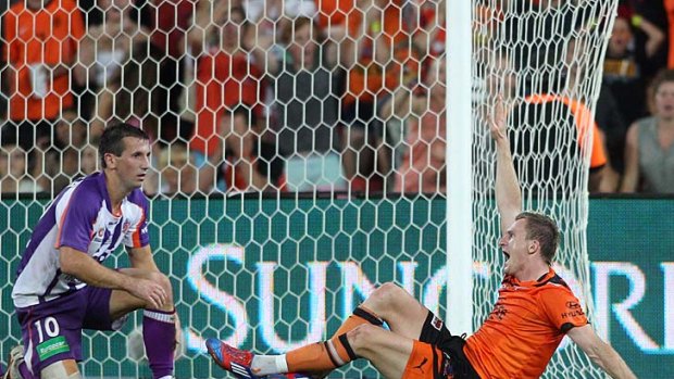 Brisbane's Besart Berisha is awarded a penalty shot at goal after being brought down by Perth's Liam Miller.