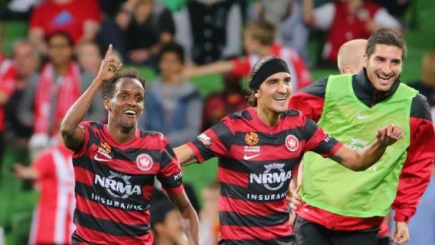 The Wanderers celebrate Youssouf Hersi's match-winning goal against Melbourne Heart.