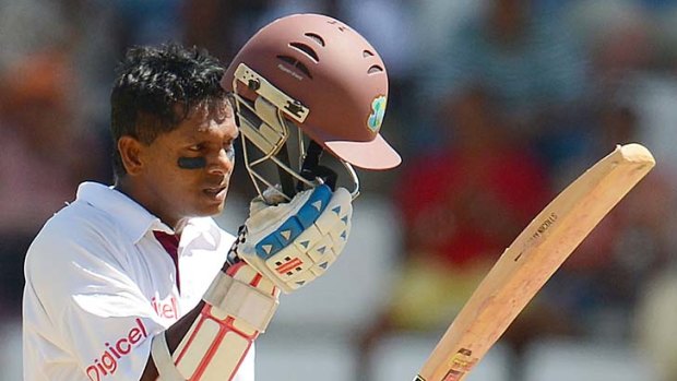 The moment ... West Indies batsman Shivarine Chanderpaul celebrates his 10,000th Test run.