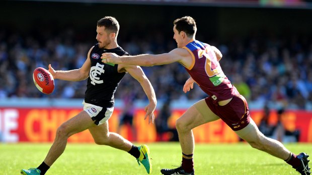 BRISBANE, AUSTRALIA - AUGUST 13: Matthew Wright of the Blues gets a kick away during the round 21 AFL match between the Brisbane Lions and the Carlton Blues at The Gabba on August 13, 2016 in Brisbane, Australia. (Photo by Bradley Kanaris/Getty Images)