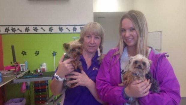 Pistol and Boo, with dog groomers Lianne and Ellie Kent, who unwittingly alerted authorities to their presence in the country.