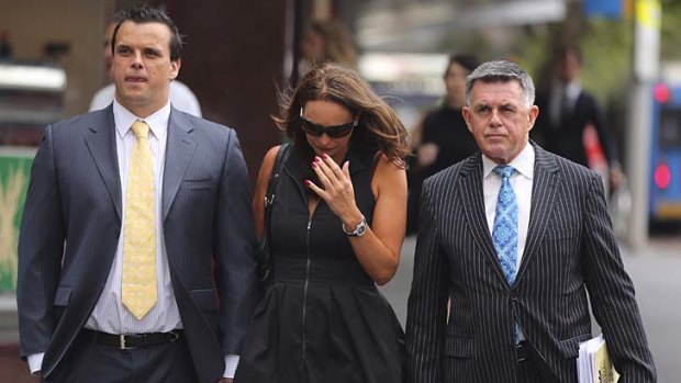 Before: Olympic swimmer Scott Miller (left) approaches the Downing Centre Local Court, Sydney, with his girlfriend and lawyer Greg Goold.