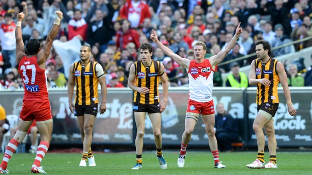 Grand performance: Mitch Morton, second right, celebrates winning the 2012 grand final.