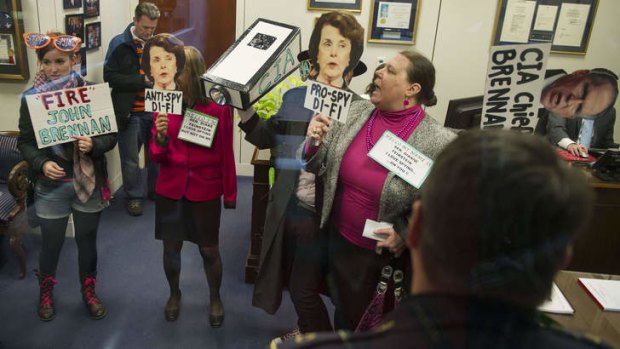 Protesters from Code Pink at the office of Dianne Feinstein hold a demonstration to 'expose her two-faced stance on spying'.