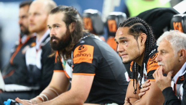 Opposite sides: Aaron Woods, left, will do battle with Martin Taupau, right, for the first time when the Tigers face Manly on Monday.