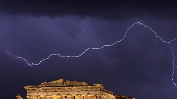 Storm warning: A bolt of lightning strikes over the ancient Parthenon in Athens.