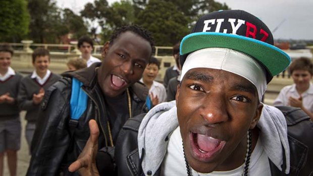 Rhyming the wrongs ... Fablice and G-Storm of hip-hop act the Flybz at Melbourne's Xavier College. The pair are refugees from Burundi who are now making their name as rap artists.