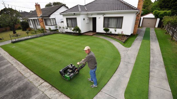 Chris Sadowski on his near perfect front lawn at his Oakleigh South home. 