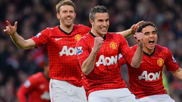 One down, two to go: Robin van Persie, with Michael Carrick (left) and Rafael, celebrates the first goal of his hat-trick.