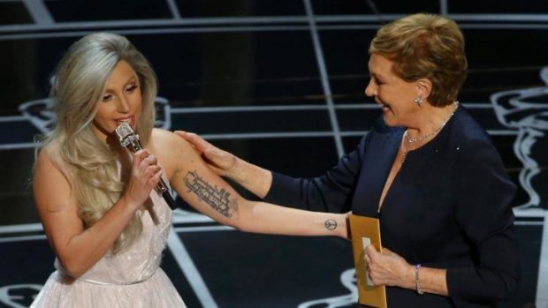 Sound of success ... Julie Andrews congratulates Lady Gaga at the Oscars.