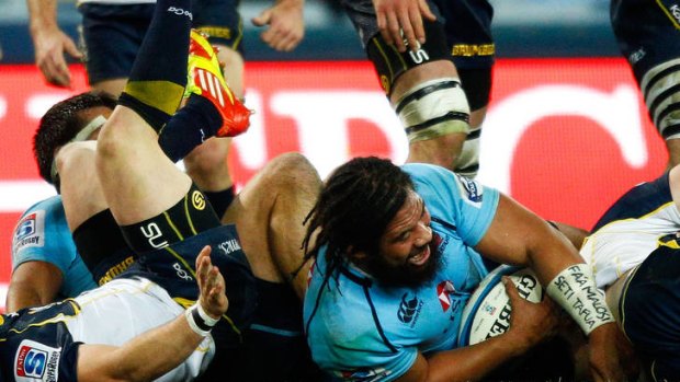 Tatafu Polota-Nau scores for the Waratahs.