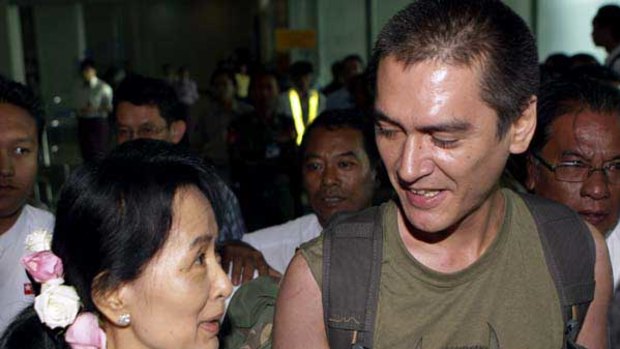 Aung San Suu Kyi meets son Kim Aris at Rangoon Airport.