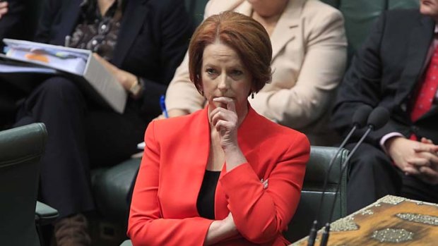 Prime Minister Julia Gillard listens to the debate over asylum seekers.
