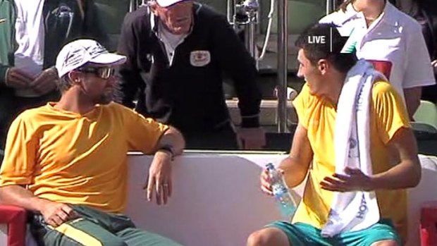 An animated Tony Roche (centre) talks to Bernard Tomic (right) as Australia's Davis Cup captain Pat Rafter looks on.