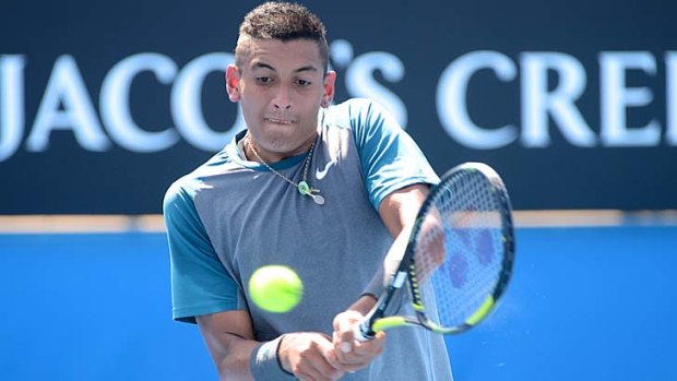 Nick Kyrgios keeps his eyes on the ball during his match against Benjamin Becker on Tuesday.