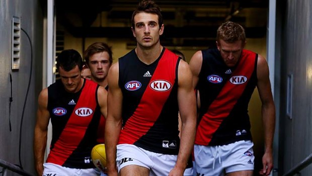 Essendon players walk out to face Brisbane on Saturday. It is not clear which players could receive show-cause letters.