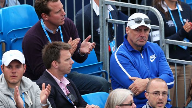 Man in the stands ... John Tomic (right) watches son Bernard at Queen's Club.