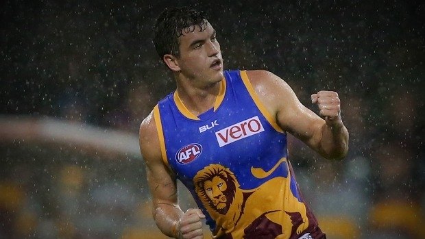 BRISBANE, AUSTRALIA - JULY 26:  Tom Rockliff of the Lions celebrates a goal during the round 18 AFL match between the Brisbane Lions and the Gold Coast Suns at The Gabba on July 26, 2014 in Brisbane, Australia.  (Photo by Chris Hyde/Getty Images)