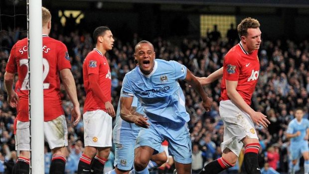 Advantage City ... Manchester City's Vincent Kompany celebrates the winner.