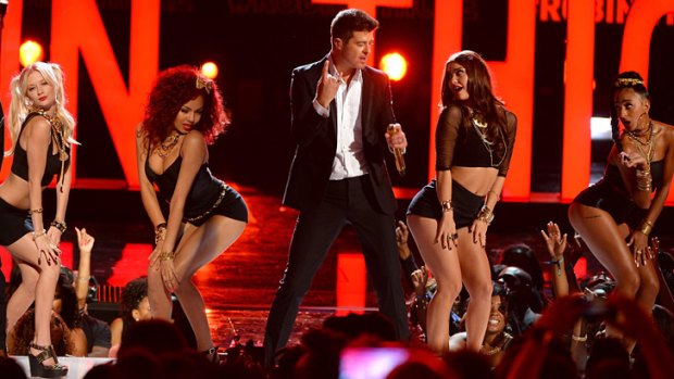 Robin Thicke tones down <i>Blurred Lines</i> performance at the 2013 BET Awards.