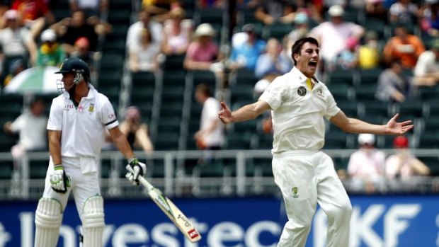 Patrick Cummins of Australia appeals unsuccessfully for the wicket of AB de Villiers of South Africa during the third day of the second test in Johannesburg.