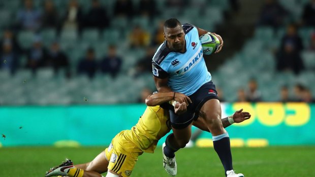 Alleged foul play: Taqele Naiyaravoro makes a break against the Hurricanes in Sydney on Saturday. 
