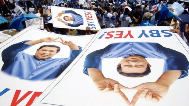 Supporters hold banners of Indonesian President Susilo Bambang Yudhoyono at an election campaign in 2009.