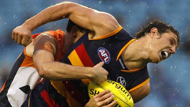 Charged ... Kurt Tippett and the Adelaide Crows.