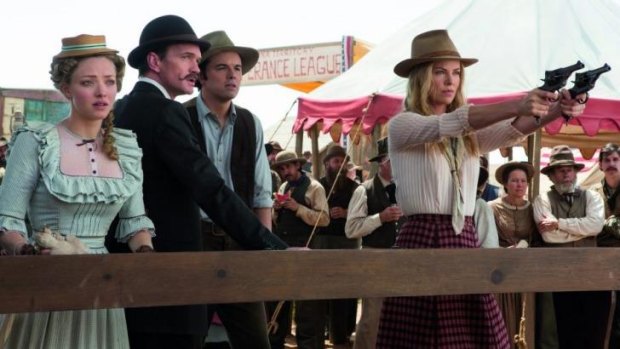 Charlize Theron takes aim in <em>A Million Ways To Die In the West</em>.