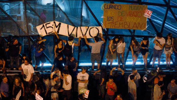 Youths demonstrate against political leaders' handling of jobs crisis in Spain, where the youth unemployment rate has risen to more than 50 per cent.