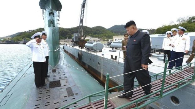 Kim Jong-un boards the submarine during his inspection.