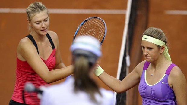 Belarus' Victoria Azarenka (R) congratulates Russia's Maria Sharapova (L) after the final of the WTA Porsche Tennis Grand Prix in Stuttgart. Sharapova won 6-1, 6-4.