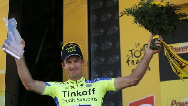 Emotional victory ... stage winner Michael Rogers celebrates on the podium of the sixteenth stage in Bagneres-de-Luchon, France