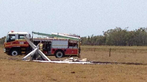 A fire truck is parked near the remains of the light plane at Burrum Heads.