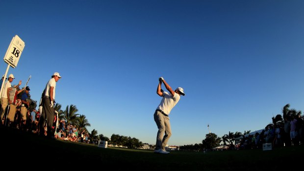 Nearly in the water: Scott of Australia tees off on the final hole.