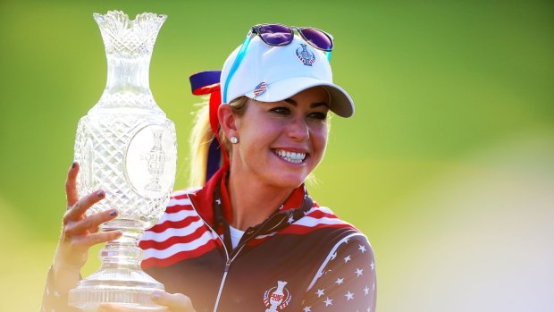 Spoils of victory: Paula Creamer of the Unitedt States Team shows the trophy after the closing ceremony at the 2015 Solheim Cup.