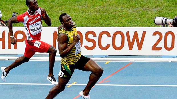 King of the sprints: Usain Bolt eased his way through the heats of the 100 metres.