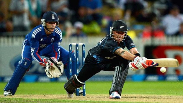 Brendon McCullum stretches out to play a reverse sweep during his unbeaten knock of 69.