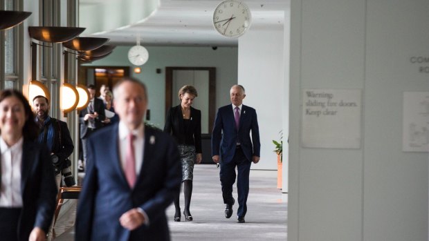 Prime Minister Malcolm Turnbull and Minister for Jobs Michaelia Cash walk behind Opposition Leader Bill Shorten. 