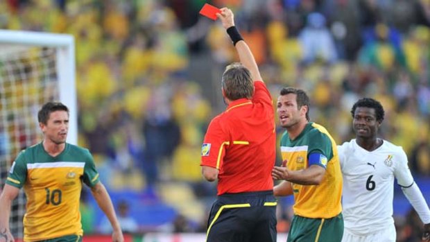 Controversial ... Italian referee Roberto Rosetti shows a red card to Harry Kewell