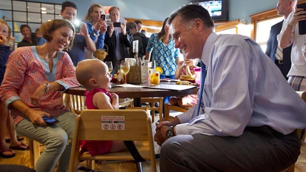 Crowd pleaser ... Mitt Romney makes a stop at Millie's.
